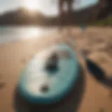 Essential paddle boarding gear displayed on a sandy beach