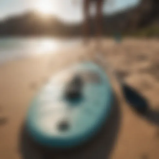 Essential paddle boarding gear displayed on a sandy beach