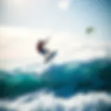 Airton Cozzolino performing a spectacular kite surfing maneuver over the waves.