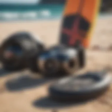 Diverse kiteboarding gear laid out on the beach