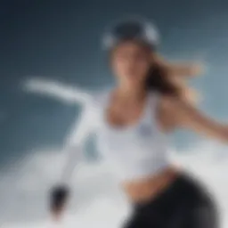 Athletic female snowboarder performing a trick in a tight shirt crop top