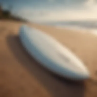 Close-up of a 7ft surfboard on a sandy beach