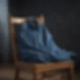 Elegant blue corduroy shirt draped over wooden chair
