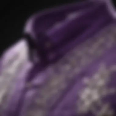 Close-up of intricate embroidery on a purple shirt