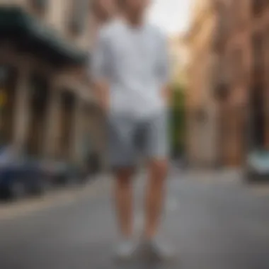 Gray sweatshorts paired with a crisp white shirt and loafers