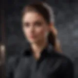 Elegantly draped black button-up shirt on marble backdrop