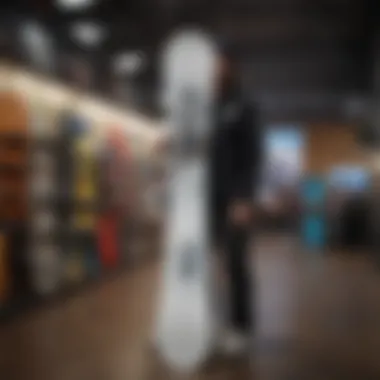 Choosing the Right Burton Custom Snowboard An individual inspecting a Burton Custom snowboard in a retail setting.