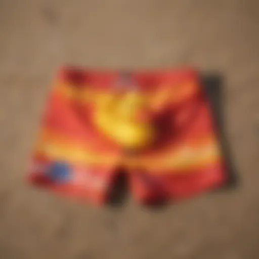 Vibrant ducky swim trunks displayed on a sandy beach