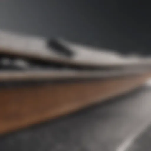 Close-up view of a medium flex snowboard showcasing its construction materials