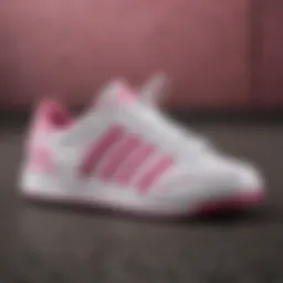 Adidas white with pink stripes footwear showcased in an urban extreme sports setting