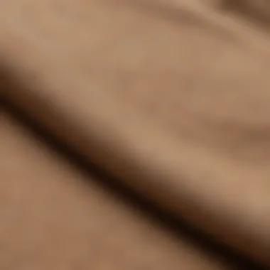 A close-up view of the fabric texture of a tan hoodie, emphasizing its quality material for outdoor activities.