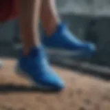 Dynamic athlete showcasing blue Adidas footwear in an extreme sports setting