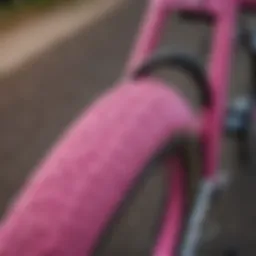 Close-up of a vibrant pink BMX tire on a bike