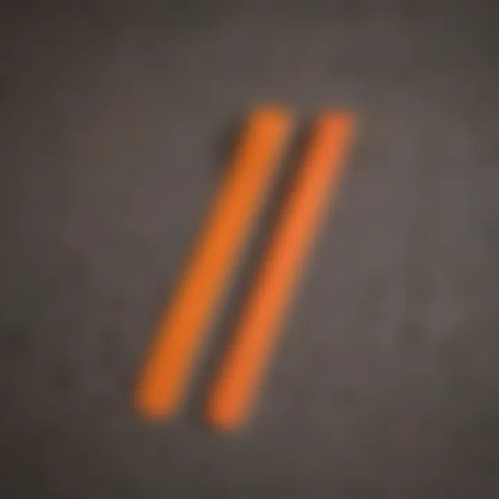 A collection of different styles of orange grip tape laid out side by side