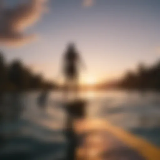 A serene lake with a paddle surfer gliding across the water at sunset