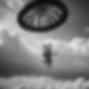 Sky's the Limit A skydiver in free fall wearing a black and white bikini top under the open parachute against the backdrop of clouds