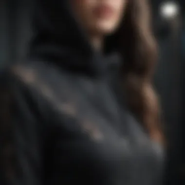 Intricate Lace Detailing on Black Hoodie Elegant black hoodie with intricate lace detailing