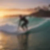 Surfer catching a wave at sunset