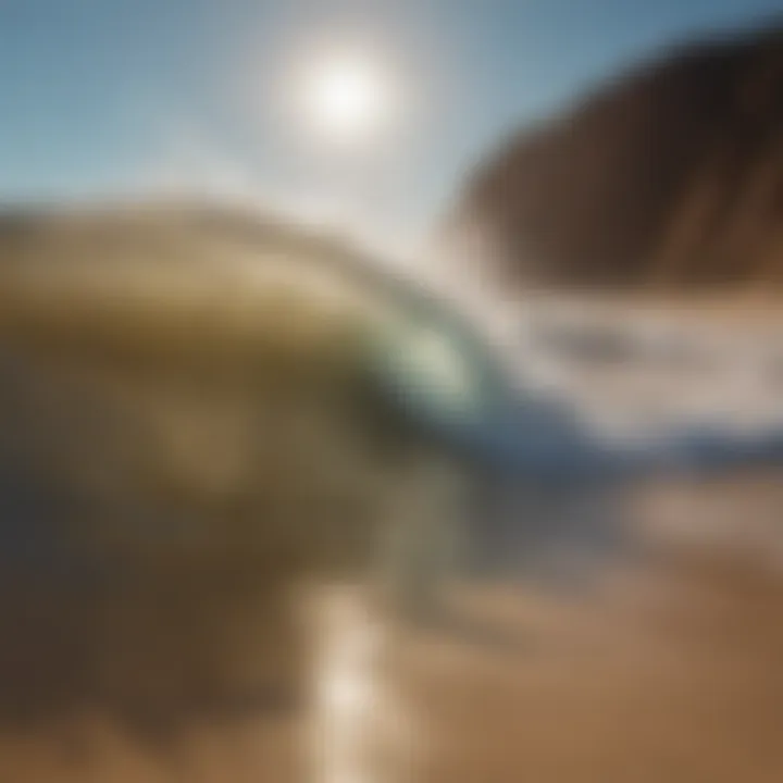 Golden sandy beach with softly lapping waves under clear blue sky