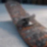 Close-up of a snowboard showcasing intricate design patterns and textures.