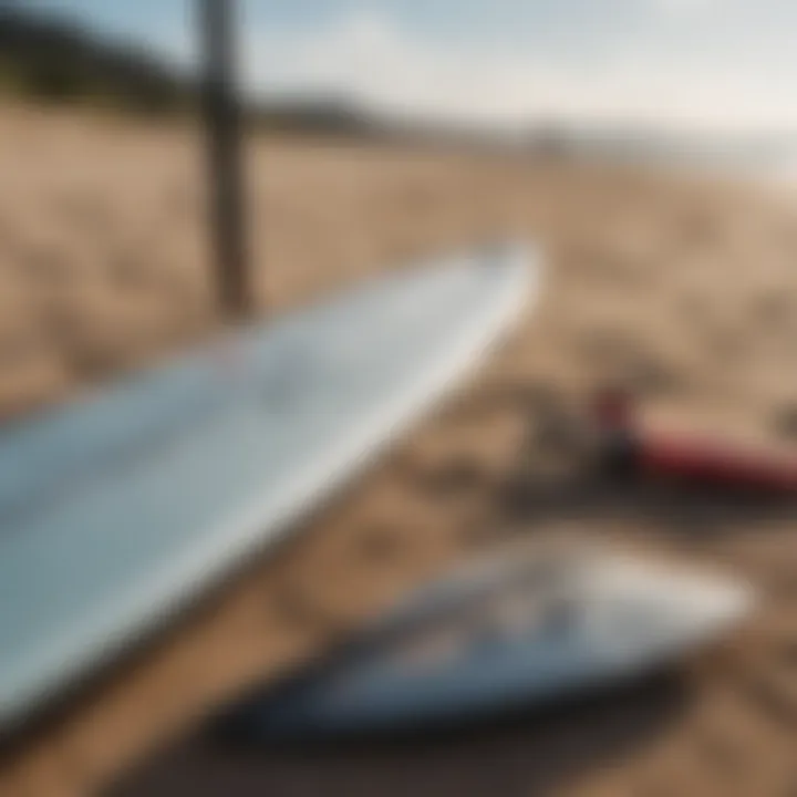 Close-up of kite surfing equipment laid out on the beach