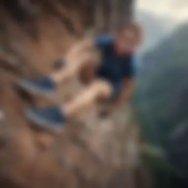 Aerial view of a fearless female athlete conquering a steep mountain peak