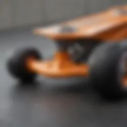 Detailed view of orange skateboard truck design showcasing precision engineering