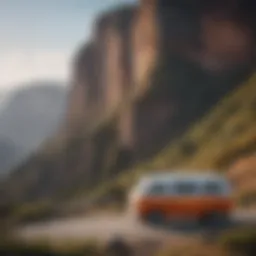 Orange and white van parked at the edge of a cliff overlooking a vast valley