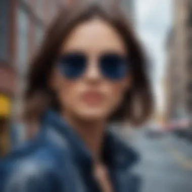 Person wearing dark blue aviator sunglasses in urban cityscape