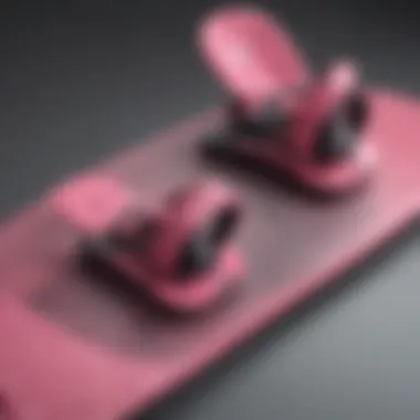 Different styles of pink snowboard bindings on various snowboards
