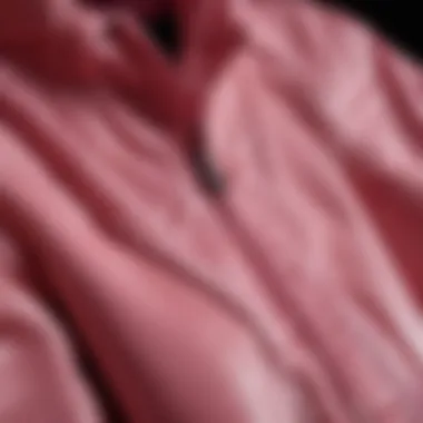 Close-up of a pink windbreaker jacket with intricate stitching details