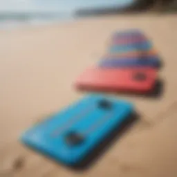 Vibrant plastic boogie boards lined up on a sandy beach