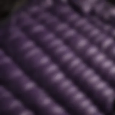 Quilted Aesthetics Close-up of intricate quilted pattern on a purple puffer jacket