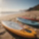 A diverse range of paddle boards displayed on a sunny beach, highlighting various sizes and shapes.