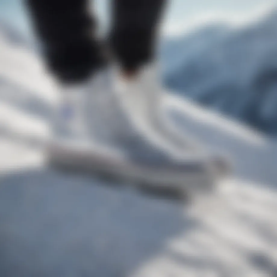 Silver Converse high tops on a snow-covered mountain slope