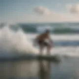 A beginner skimboarder gliding over the ocean waves.