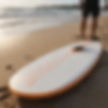 Essential skimboarding equipment laid out on the beach.