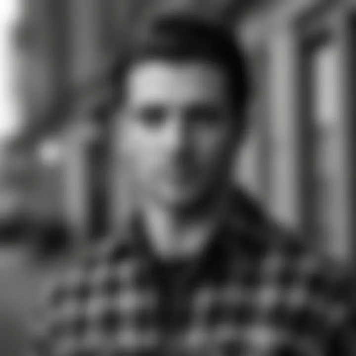 Fashionable man wearing black and white flannel shirt in urban setting