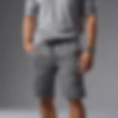 Gray sweatshorts accessorized with a statement watch and sunglasses