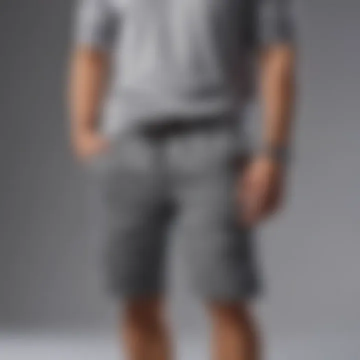 Gray sweatshorts accessorized with a statement watch and sunglasses