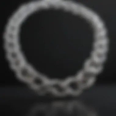 Elegant white gold chain reflecting light against a dark background