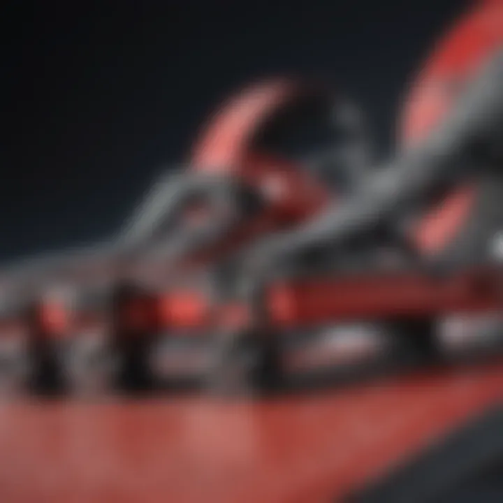 Close-up of red snowboard bindings showcasing intricate design
