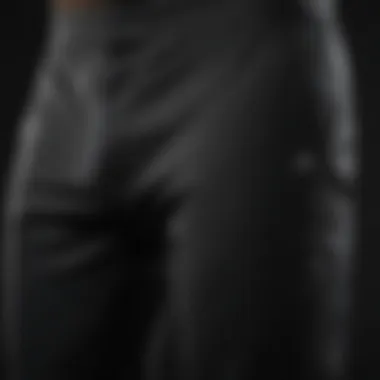 Close-up of black Adidas pants highlighting advanced fabric technology