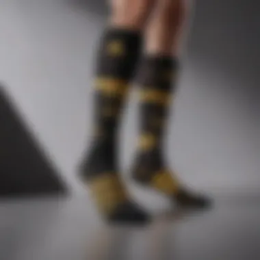 Stylish presentation of black and gold Adidas socks on a minimalist background emphasizing their design appeal.