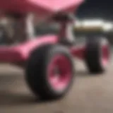 Close-up of pink skateboard trucks showcasing detailed construction