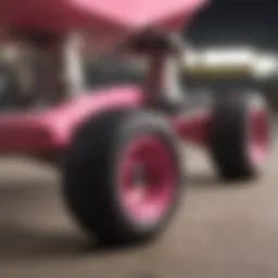 Close-up of pink skateboard trucks showcasing detailed construction