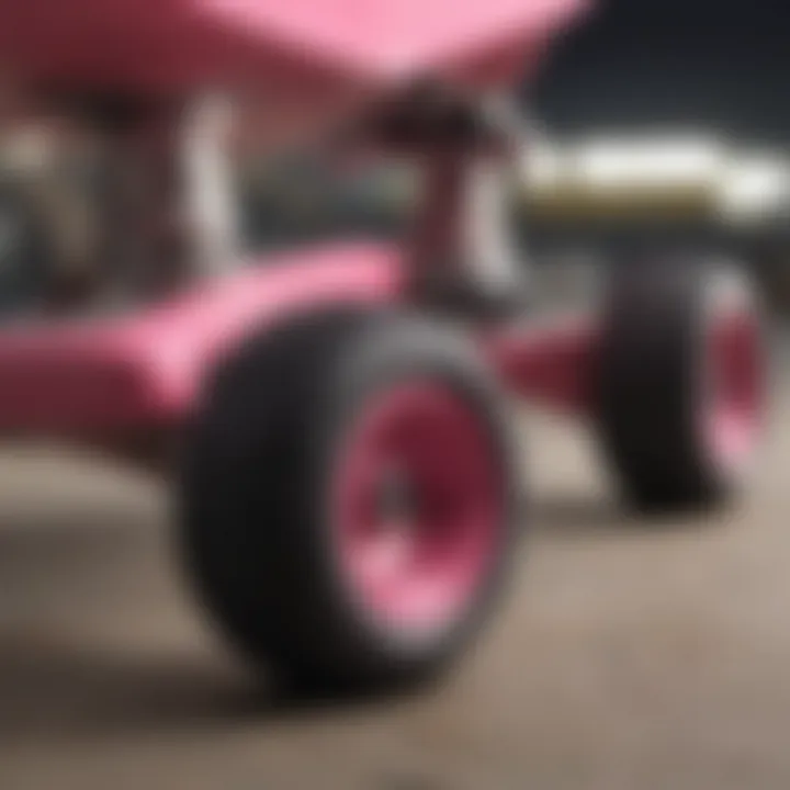 Close-up of pink skateboard trucks showcasing detailed construction