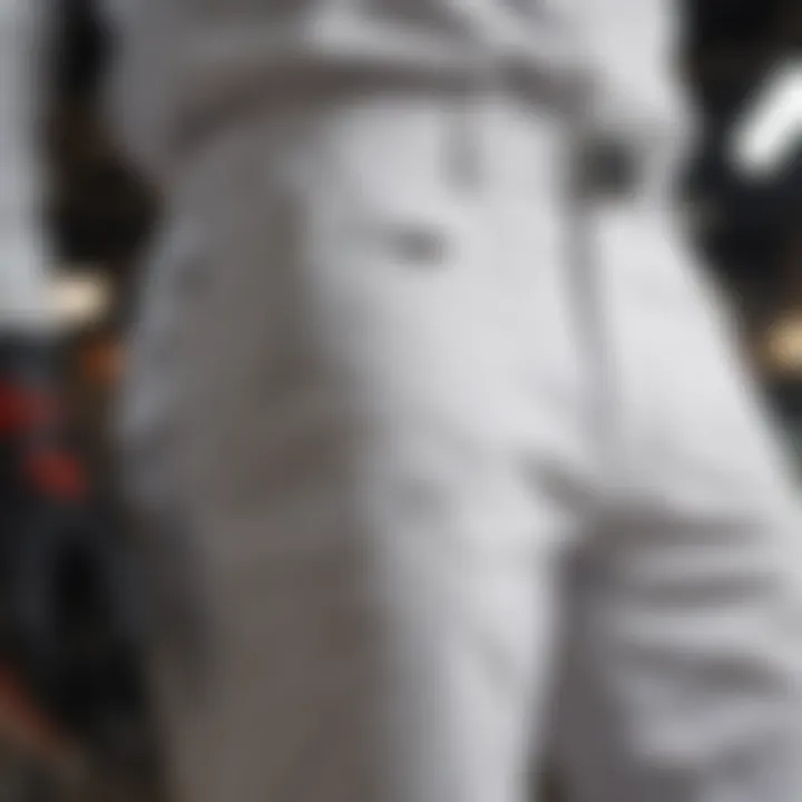 Close-up of white BDU pants detailing durability features