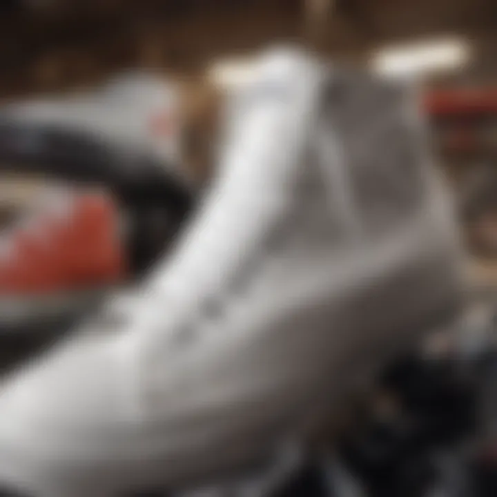 Close-up shot of white Chuck shoes against a backdrop of extreme sports equipment