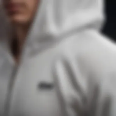 Close-up of the high-quality fabric and stitching of a white Mike hoodie